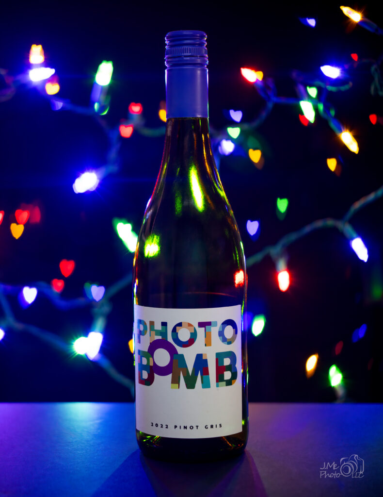 Wine bottle lit with heart shaped bokeh